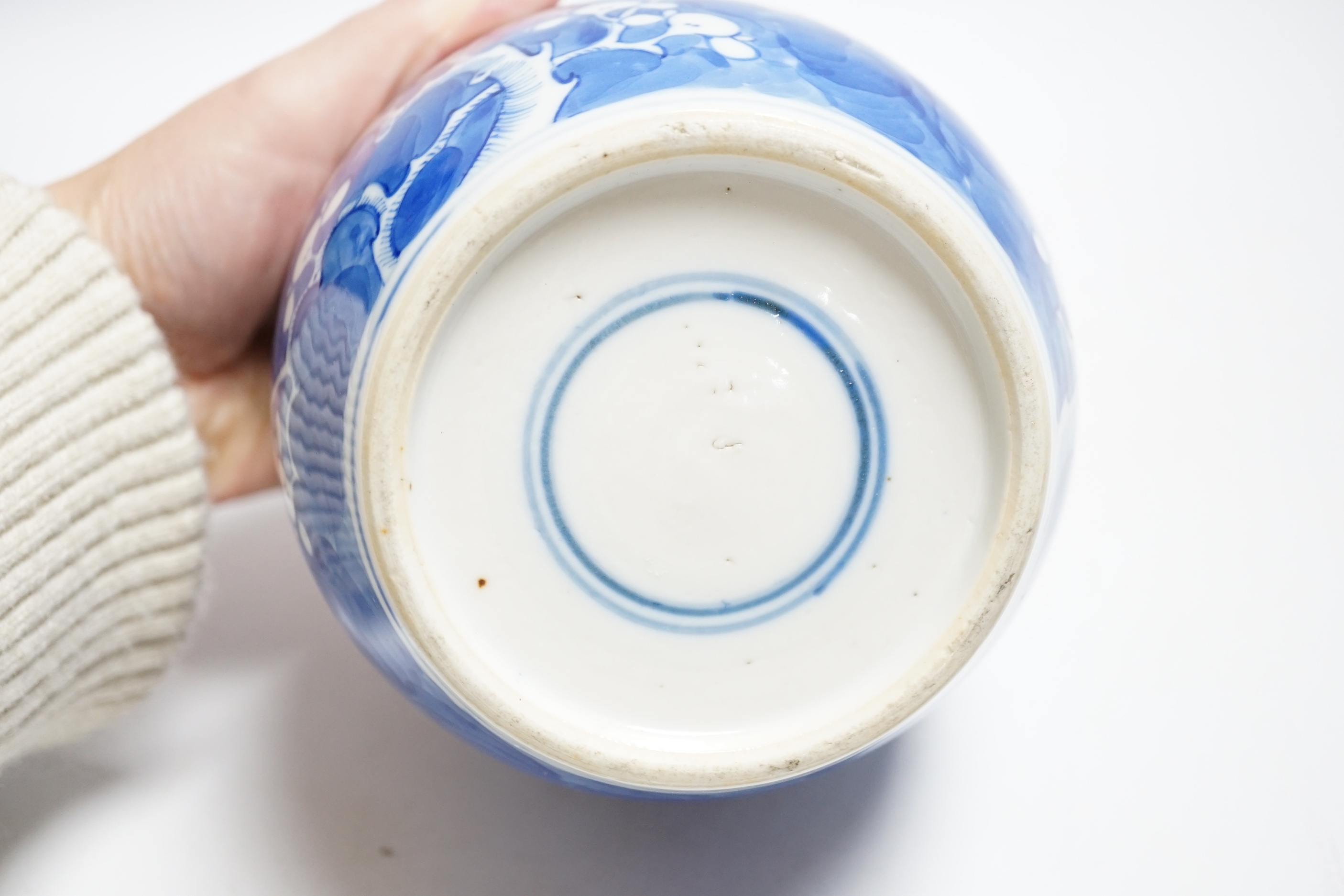 An early 20th century Chinese blue and white prunus jar and cover, 14cm